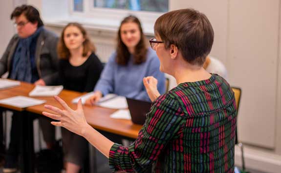 Teacher leading class discussion